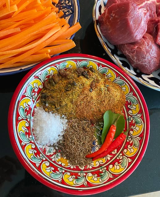 Fresh plov ingredients: carrots, meat and spices
